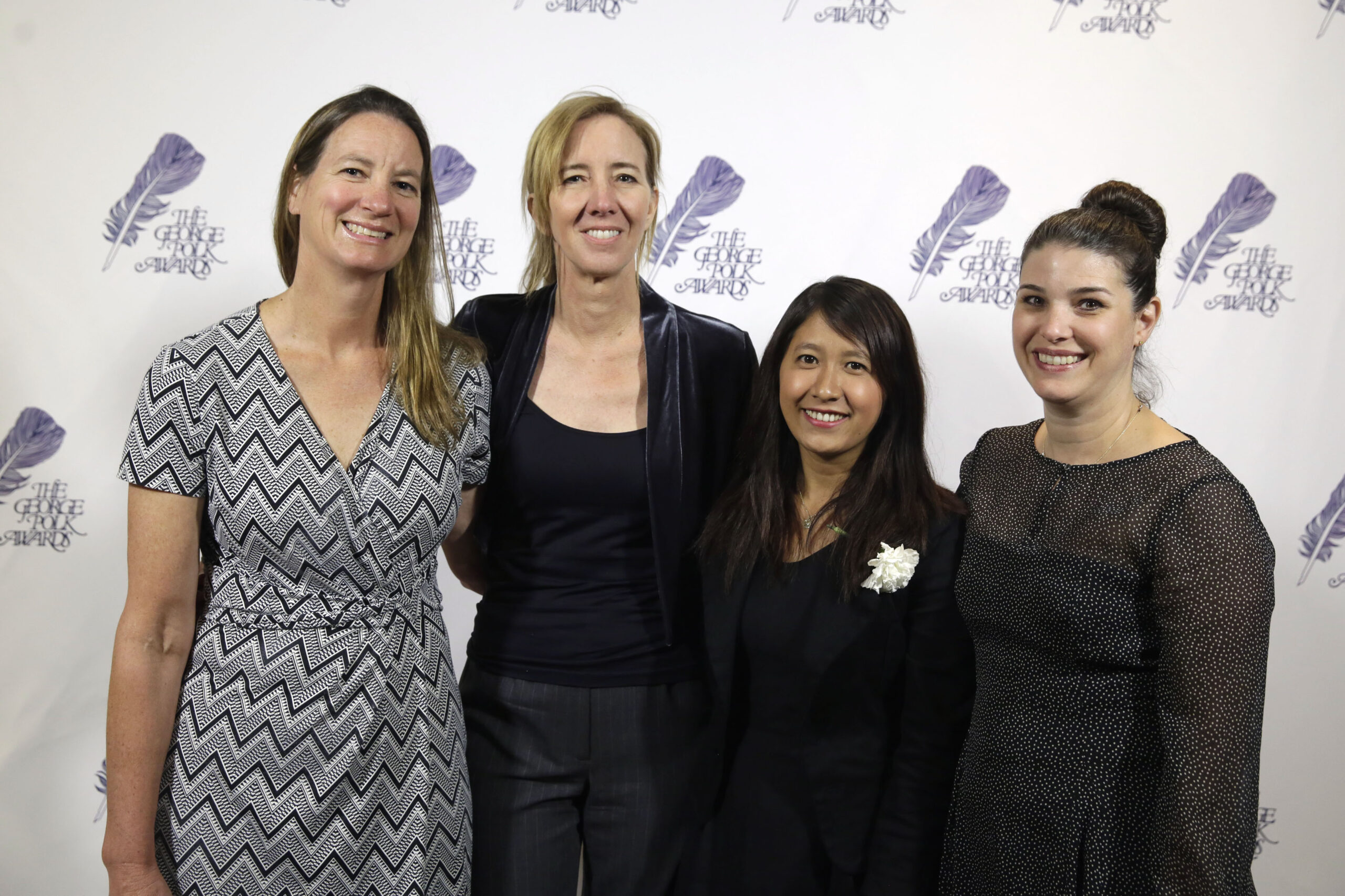 The AP team that investigated seafood caught by slaves poses at the George Polk Awards luncheon in New York, Friday, April 8, 2016. From left: Martha Mendoza, Robin McDowell, Esther Htusan and Margie Mason. (AP Photo/Richard Drew)